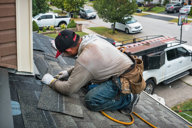 Professional Roof Replacement technician working in Stockbridge, MA